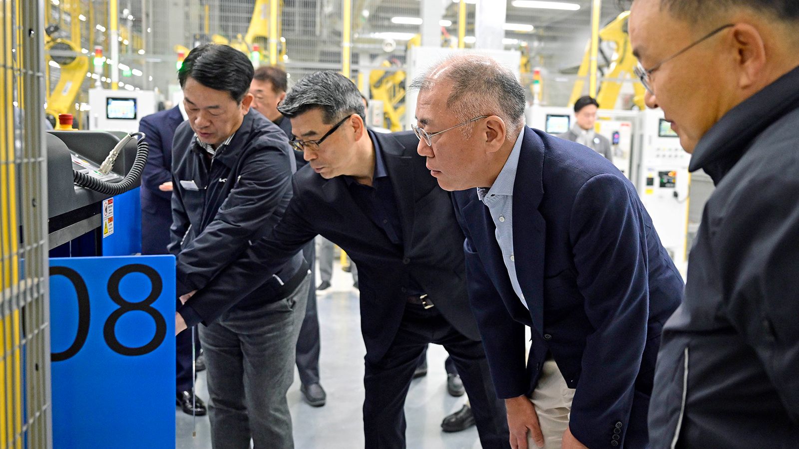 Hyundai Motor Group Executive Chair Euisun Chung looks around Kia AutoLand Gwangmyeong and encourages the employees