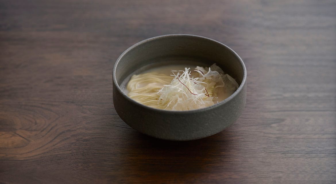 Seolloengtang features long-simmered beef, white cloud mushrooms, and house-made noodles, exemplifying the art of slow cooking.