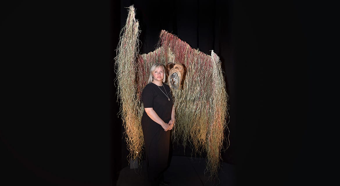 Máret Ánne Sara (1983-) with her artwork at the exhibition “Environmental Injustice – Indigenous Peoples’ Alternatives” (2021-2022) at Musée d’ethnographie de Genève (MEG), Switzerland 2021 MEG Inv. ETHPH  90345 © Photo Johnathan Watts, MEG