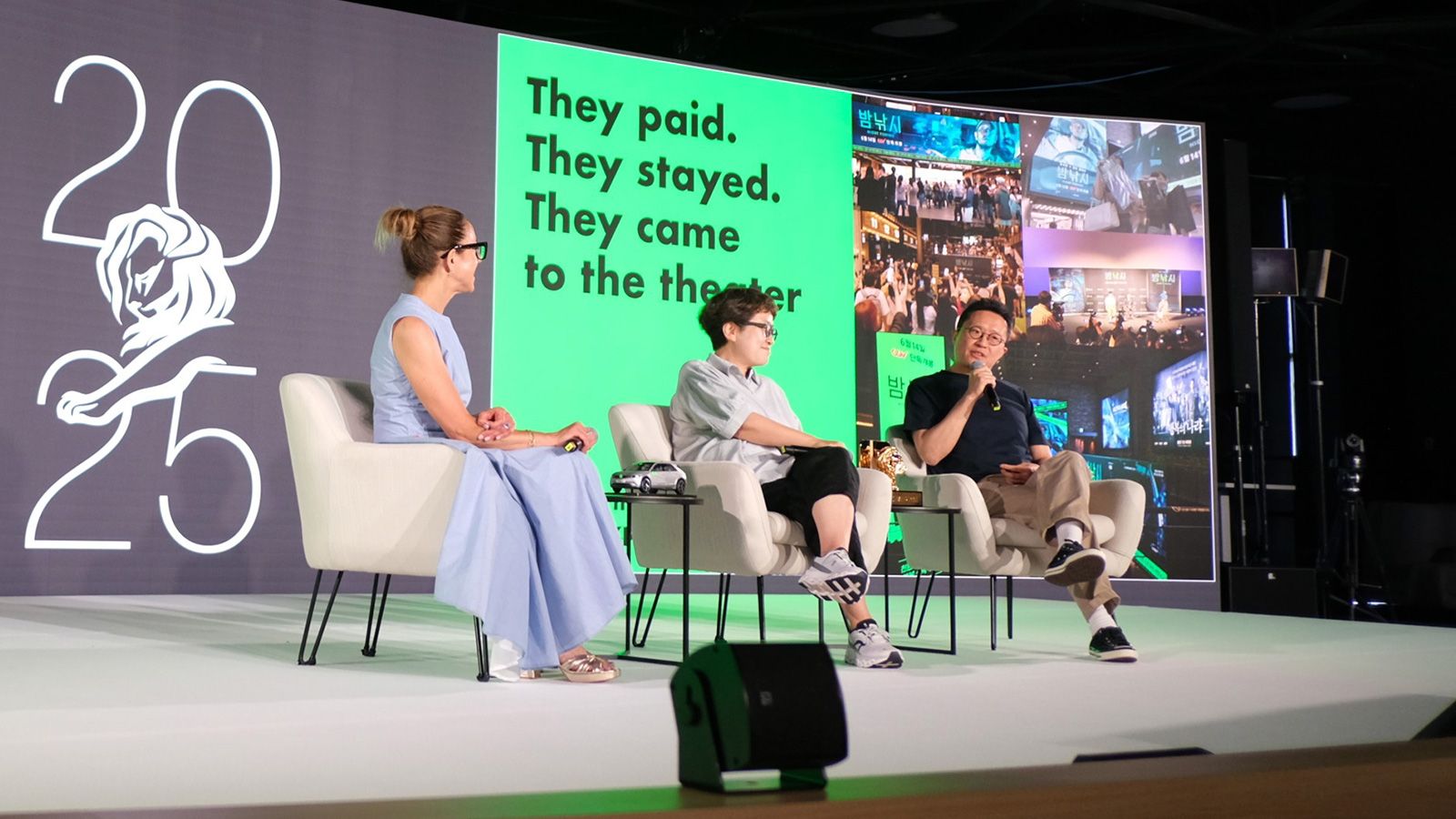 Sungwon Jee and Jung A Kim on stage with moderator