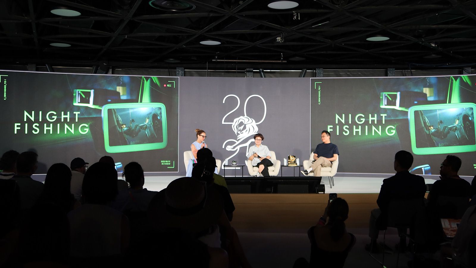 Sungwon Jee and Jung A Kim on stage with moderator