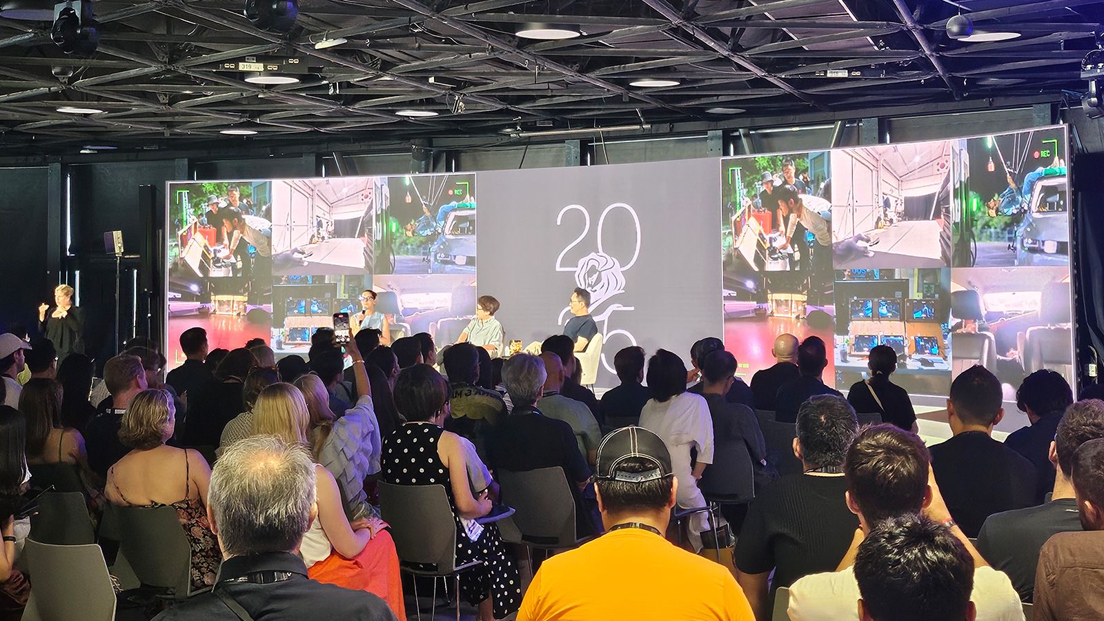 Sungwon Jee and Jung A Kim on stage with moderator