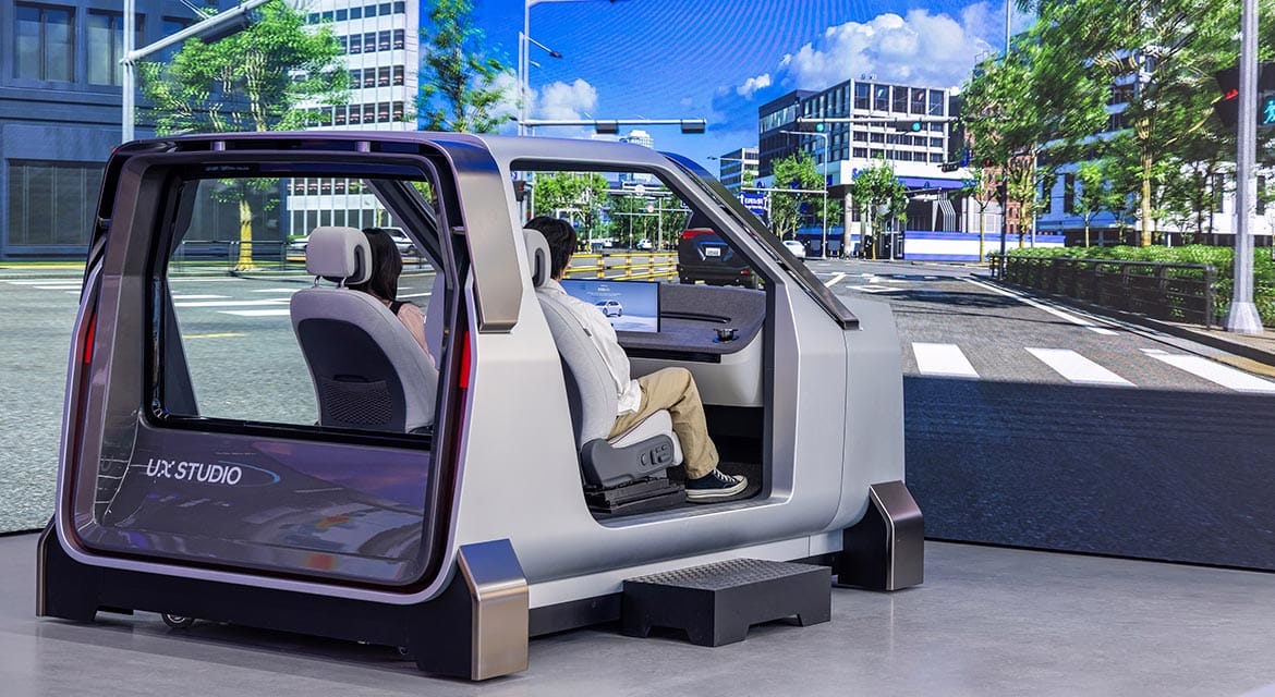 UX Validation includes a validation buck for driving simulations, where visitors can interact with various in-vehicle devices as part of a virtual driving environment projected on LED panels.