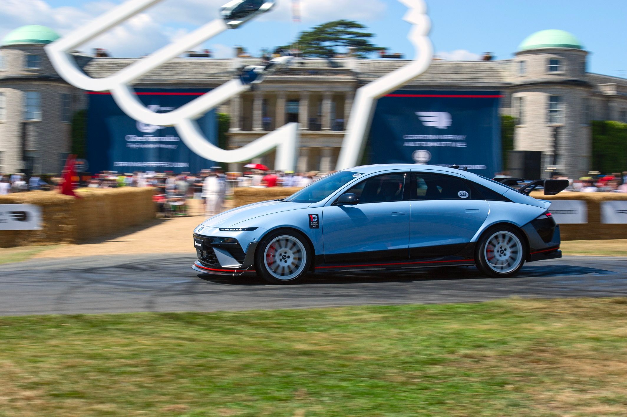 Driver-area view with Performance Blue accents; Hyundai pairs virtual shifts with synchronized sound and ambient-light cues.