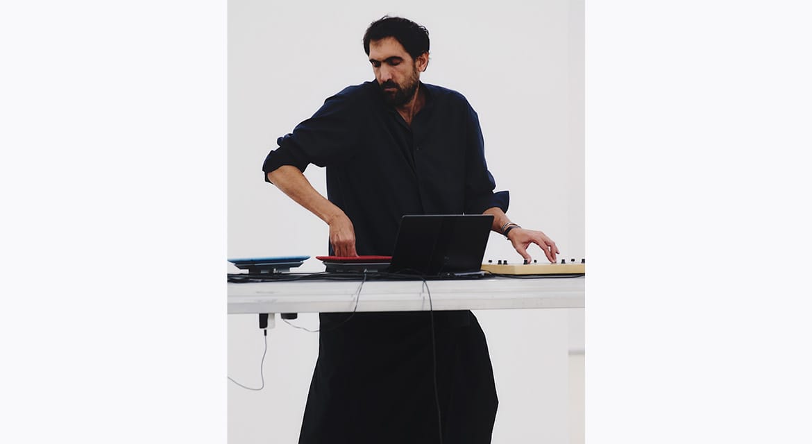 Tarek Atoui performs at the Issey Miyake Spring-Summer 2026 presentation at Centre Pompidou, Paris. October 2025. Photo © Luna Conte.