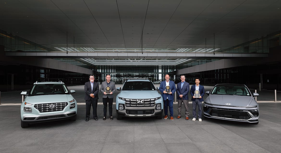 JD Power’s David Sargent, vice president and Robert Mansfield vice president, global automotive present JD Power 2026 U.S. IQS trophies to Barry Ratzlaff, chief customer officer, Natha