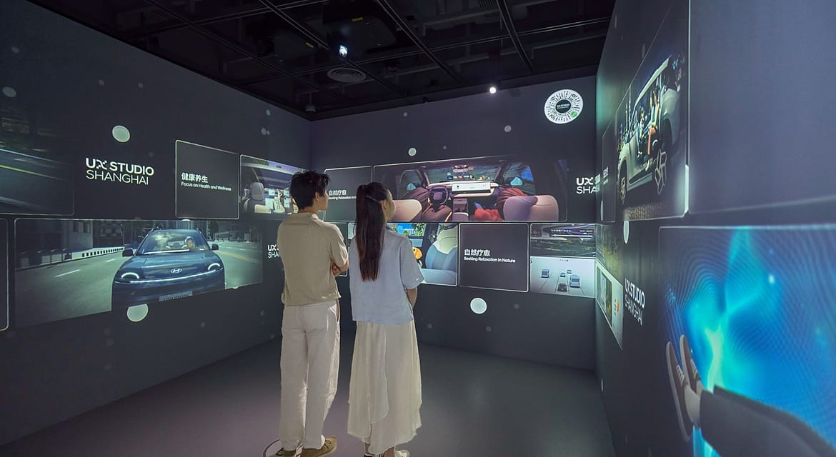 Visitors experience immersive video content at the UX Vision Room in the UX Explorer Zone, showcasing future mobility usage trends identified through extensive user experience research.