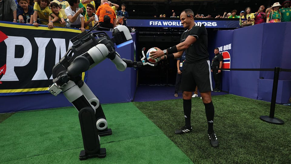 Atlas® delivers the ceremonial match ball to the referee during halftime of a Round of 16 match at New York/New Jersey Stadium at the FIFA World Cup 2026™.