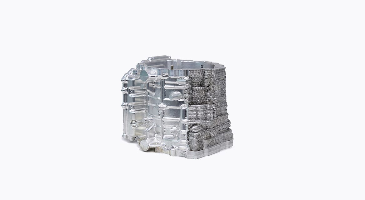 A sample metal component after partial CNC machining, demonstrating post-processing of an additively manufactured part.