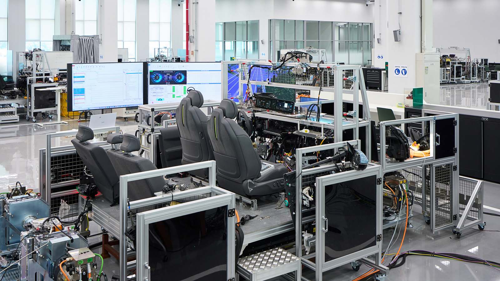 Engineer validates vehicle functions and electronic control systems using a full-scale wire-car test bench at NOVA Lab.