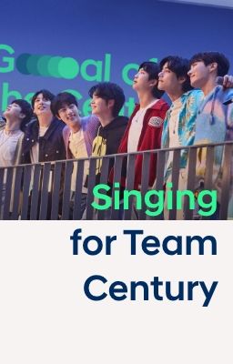 All 7 members of BTS on stage facing an unseen audience with 'Century' written in green on a blue screen behind them.