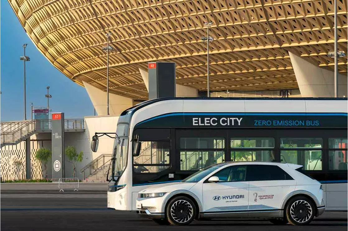 Hyundai motor company's car standing in front of a bus stop at lusail stadium