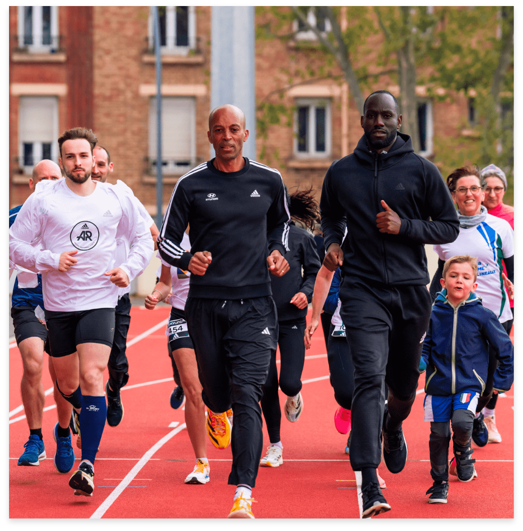 Stéphane Diagana en course avec d'autres coureurs